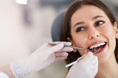 woman getting a dental checkup at Sandia View Family Dental