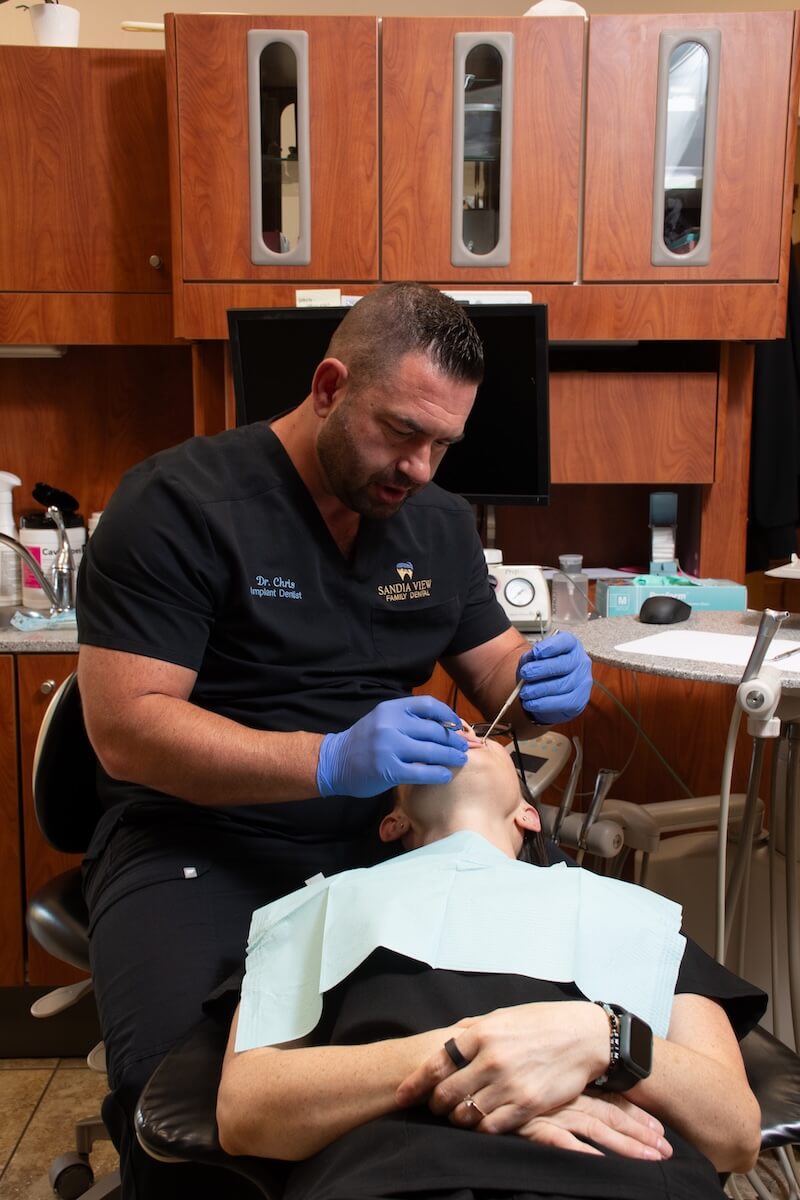 Dr. Chris Christensen with a patient in the exam chair at Sandia View in Rio Rancho NM.
